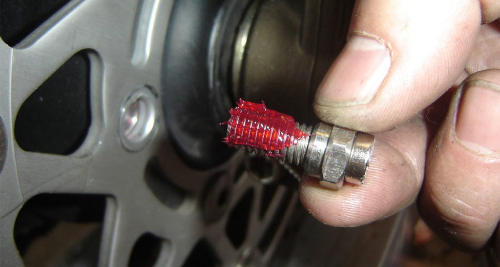 Magnetic Caliper Bolt for the Trail Tech Vapor speedometer functionality, using Red Locktite on the bolt