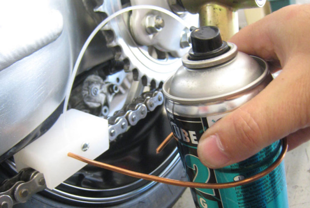 How to hold the Grease Ninja to properly lube a motorcycle chain